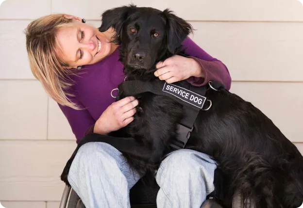 Woman in a wheelchair with her service dog